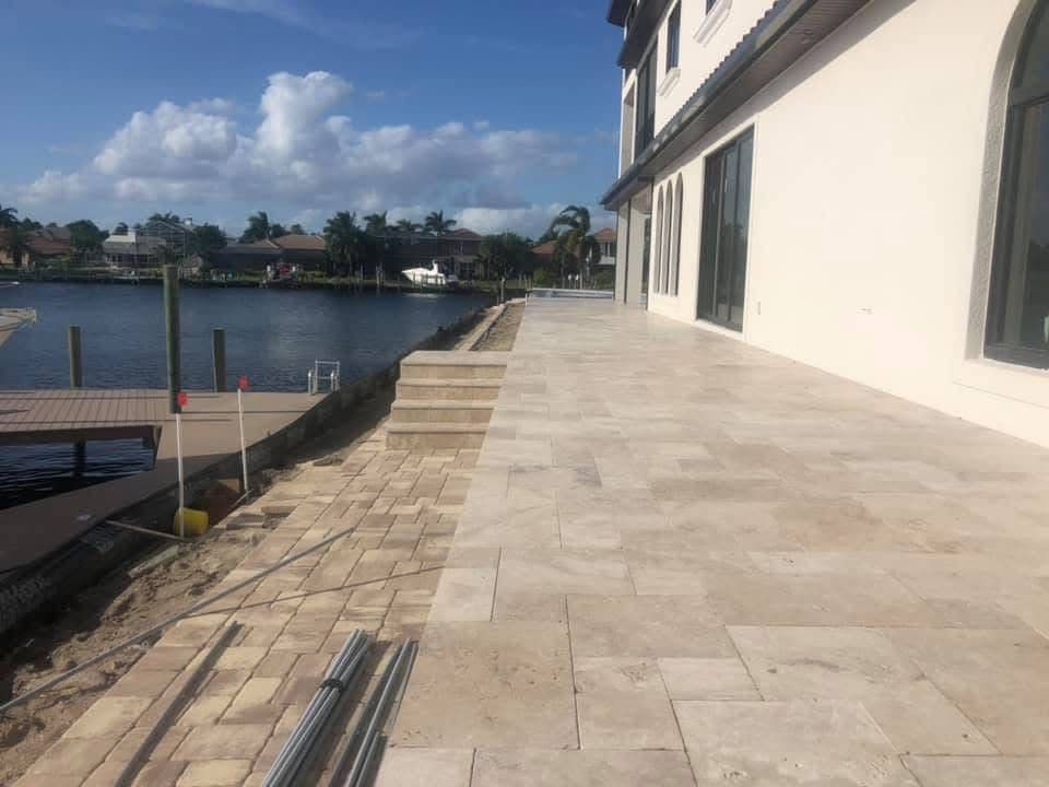 Ivory Travertine Pool Deck on a Lakefront Estate