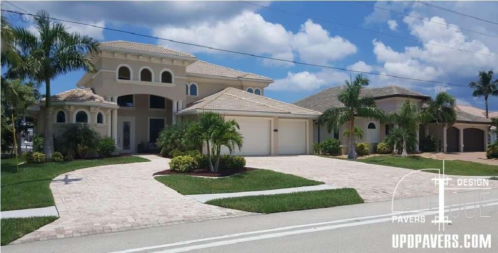 Luxury residential home with elegant architecture and landscaped yard in sunny suburb.