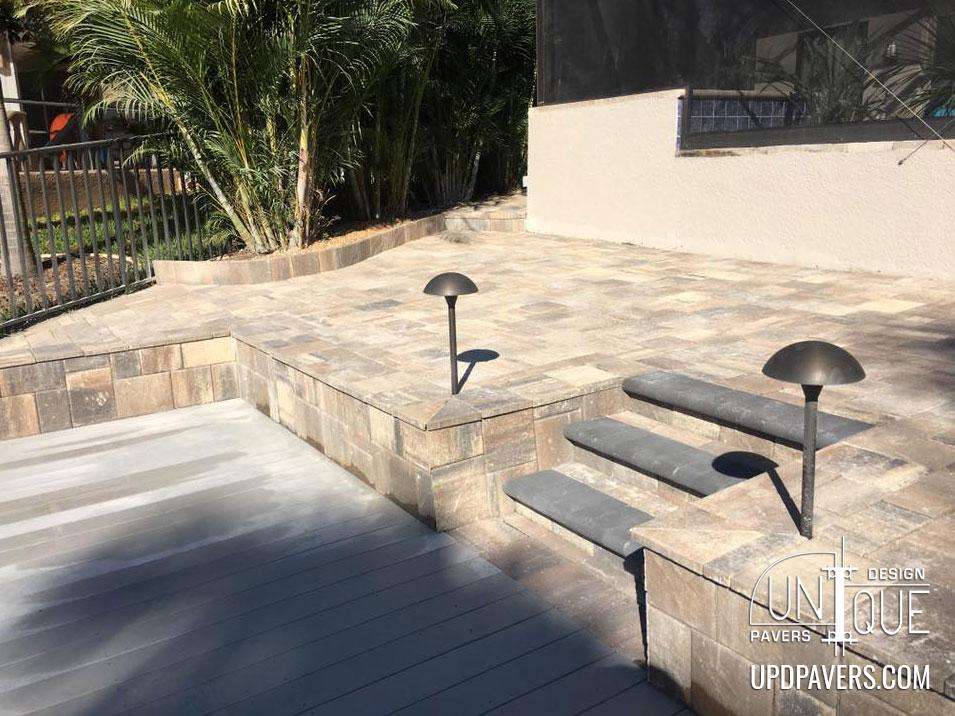 Stylish outdoor paver patio with steps and modern lighting features. Perfect for entertaining.