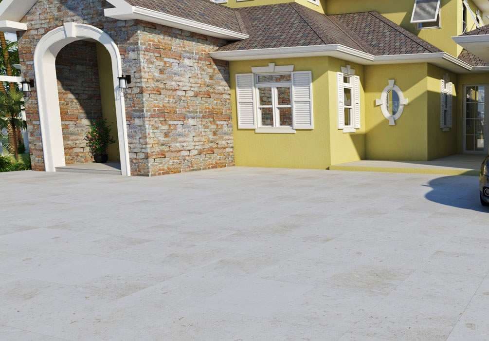 Modern yellow house exterior with stone accents and spacious driveway.