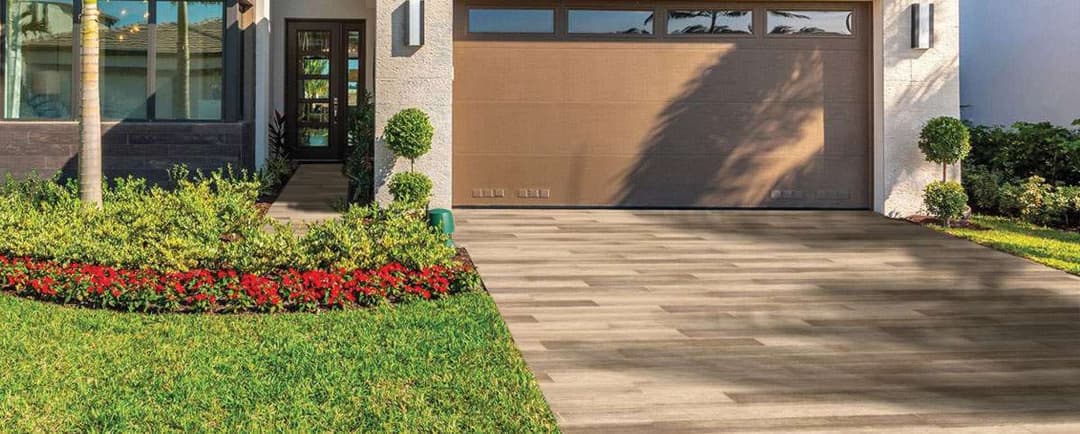 Modern home exterior with landscaped garden and stylish garage door.