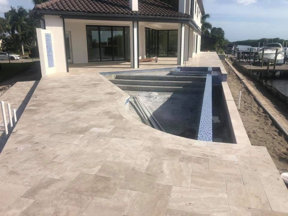Ivory Travertine Pool Deck on a Lakefront Estate