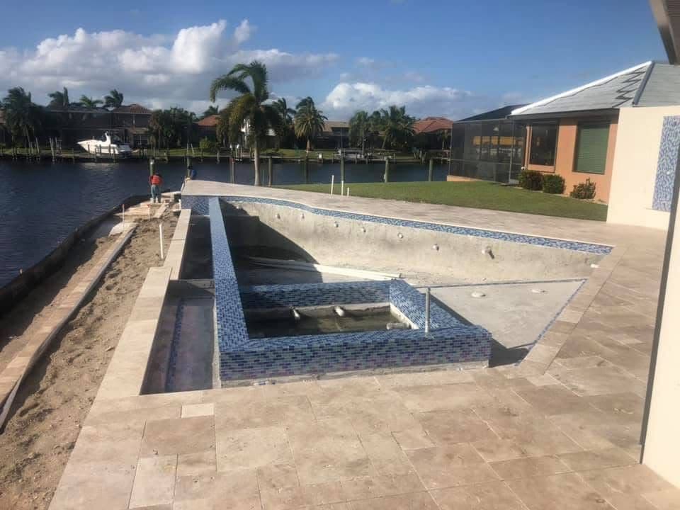 Ivory Travertine Pool Deck on a Lakefront Estate